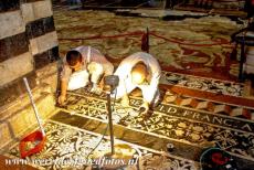 Historic Centre of Siena - Historic Centre of Siena: Two workers restoring the mosaic floor of Siena Cathedral. The marble floor mosaics of the...