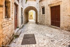 Historic City of Trogir - Historic City of Trogir: One of the narrow medieval cobbled streets in Trogir. Trogir was founded by Greek colonists, it developed into an...