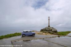 Routes of Santiago de Compostela in Spain - Route de Santiago de Compostela in Spain: Our own classic Mini, a 1974 Mini Authi, in front of the stone cross at Cape Finisterre....