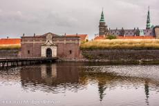 Kronborg Castle - Kronborg Castle is surrounded by a deep moat. The way into the castle passes through the Dark Gate, a dark and long tunnel-like...