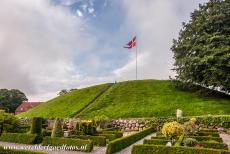 Jelling Mounds, Runic Stones and Church - Jelling Mounds, Runic Stones and Church: The south mound. The Royal Standard of Denmark is raised on the Jelling Mounds every summer Sunday....