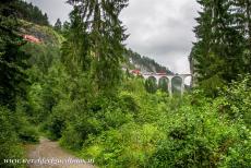 Rhaetian Railway, the Albula and Bernina Lines - Rhaetian Railway in the Albula / Bernina Landscapes: The single-track Landwasser Viaduct. The 65 meters high Landwasser Viaduct is the most...