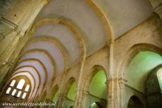Cistercian Abbey of Fontenay - Cistercian Abbey of Fontenay: The 12th century Romanesque church of the abbey. The sunlight creates beautiful colour contrasts between the lightly...