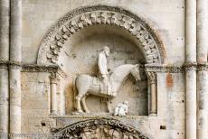 Saint Hilaire Church in Melle - Saint Hilaire Church in Melle: The sculpture above the north entrance portal depicts a crowned horseman whose horse tramples a half...