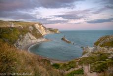 Dorset and East Devon Coast - The Dorset and East Devon Coast: The Man O' War Cove at sunset, viewed from the South West Coast Path. The Man O' War Cove is a small...