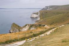 Dorset and East Devon Coast - The Dorset and East Devon Coast: Lulworth Cove is surrounded by the Lulworth Crumple, layers of rock formed by the collision of the...