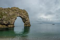Dorset and East Devon Coast - The Dorset and East Devon Coast: The iconic natural rock arch of Durdle Door at high tide on a misty morning. The Dorset and East Devon Coast also...
