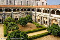 Monastery of Alcobaça - Monastery of Alcobaça: The courtyard garden is planted with orange trees. The open-arcaded cloister is one of the largest medieval...