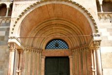 Cathedral,Torre Civica and Piazza Grande, Modena - Cathedral, Torre Civica and Piazza Grande, Modena: The Royal Gate of the Modena Cathedral. The gate is decorated with sculptures by the Campionese...