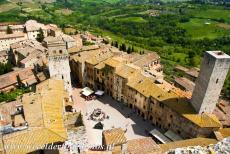 Historic Centre of San Gimignano - Historic Centre of San Gimignano: The triangular shaped Piazza della Cisterna, the town square of San Gimignano, viewed from the Torre Grossa,...