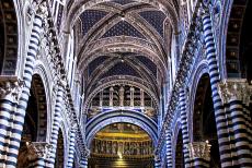 Historic Centre of Siena - Historic Centre of Siena: The vaulted ceiling and the blackish-green and white marble columns of the nave of Siena Cathedral. The vaults...