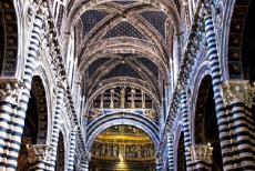 Historic Centre of Siena - Historic Centre of Siena: The vaulted ceiling and the blackish-green and white marble columns of the nave of Siena Cathedral. The vaults...