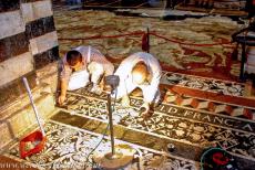 Historic Centre of Siena - Historic Centre of Siena: Two workers restoring the mosaic floor of Siena Cathedral. The marble floor mosaics of the...