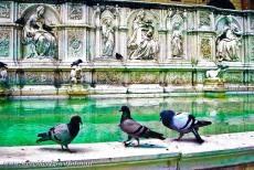 Historic Centre of Siena - Historic Centre of Siena: The square Piazza del Campo and the famous Fonte Gaia Fountain, the sculpted wolves spouting water represent...