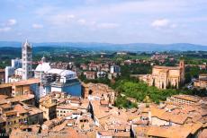 Historic Centre of Siena - The Campanile of Siena Cathedral towers high above the historic centre of Siena. The cathedral was built on the highest point of Siena. The dome...