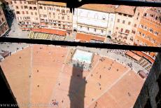 Historic Centre of Siena - Historic Centre of Siena: The Piazza del Campo and the Gaia Fountain, the Mangia Tower casts a long shadow across the square. The Piazza del Campo...