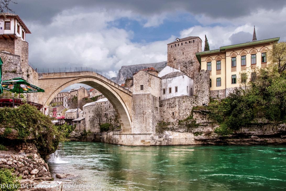 Old Bridge Area of the Old City of Mostar - Old Bridge Area of the Old City of Mostar: The green-tinted waters of the Neretva flow beneath the Old Bridge of Mostar, the Stari Most. The...