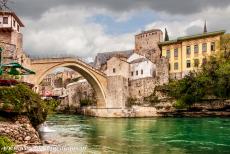 Old City of Mostar - Old Bridge Area of the Old City of Mostar: The green tinted waters of the Neretva flows beneath the Old Bridge of Mostar, the Stari Most....