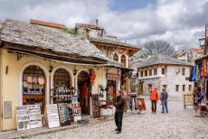 Old Bridge Area of the Old City of Mostar - The Tepa Market in the Old Bridge Area of the Old City of Mostar. The streets in the historic city of Mostar are paved with cobblestones; along...