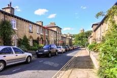 Saltaire, a Victorian model village - Saltaire: A row of 19th century small workers' houses, with&nbsp;the bell tower of the Saltaire United Reformed Church in the background. The...
