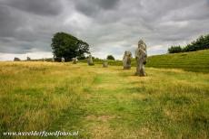 Avebury - Avebury Stone Circles and Henge: Several standing stones of the great outer stone circle, on the left hand side the circular ditch....