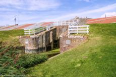 Dutch part of the Wadden Sea - Wadden Sea: An old sluice gate in the Ommelander Sea Dike at the hamlet of Noordpolderzijl. Along the shallow Wadden Sea, the...