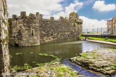 Beaumaris Castle - Castles and Town Walls of King Edward in Gwynedd: The tidal dock of Beaumaris Castle, located near the Gate Next the Sea. The deep moat around the...
