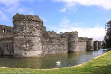 Beaumaris Castle - Castles and Town Walls of King Edward in Gwynedd: The&nbsp;outer wall and the moat of&nbsp;Beaumaris Castle. Four lines of massive fortifications...