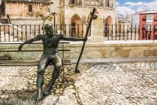 Routes of Santiago de Compostela in Spain - Route of Santiago de Compostela in Spain: A bronze statue depicting a very exhausted pilgrim outside Burgos Cathedral. Burgos is situated... Routes of Santiago de Compostela in Spain - Route of Santiago de Compostela in Spain: A bronze statue depicting a very exhausted pilgrim outside Burgos Cathedral. Burgos is situated...