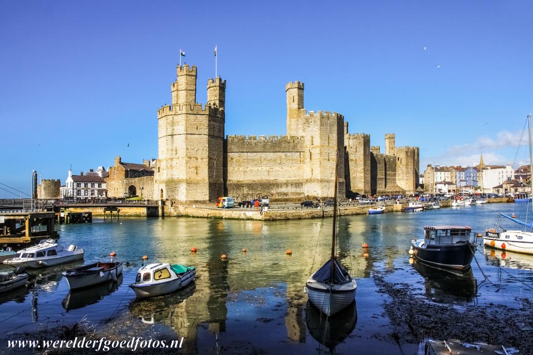 Caernarfon Castle - Castles and Town Walls of King Edward in Gwynedd: The natural harbour of the historic town of Caernarfon, Caernarfon Castle in the background....