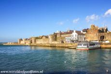 Caernarfon Castle - The town walls of Caernarfon join the walls of Caernarfon Castle. Caernarfon Castle is located in the former principality of Gwynedd in North...