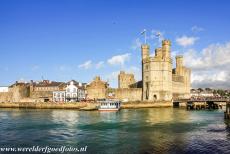 Caernarfon Castle - Castles and Town Walls of King Edward in Gwynedd: The Eagle Tower of Caernarfon Castle and the Caernarfon town walls. The town walls of Caernarfon...