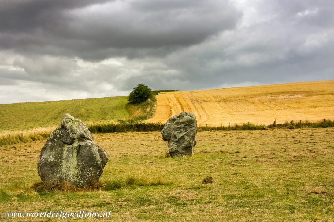 West Kennet Avenue - Stonehenge, Avebury and Associated Sites: A diamond-shaped stone of West Kennet Avenue, a pillar-like stone in the background. West Kennet Avenue...
