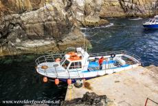 Sceilg Mhichíl - Skellig Michael - Skellig Michael: The small boat docked beside the small pier in Blind Man's Cove. The only way to reach Skellig Michael is by a...
