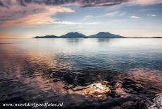 Vegaøyan - The Vega Archipelago - A breathtaking sunset over the Vega Archipelago and the Norwegian Sea. Parts of the west coast of Norwayt are fringed by a strand flat: numerous...