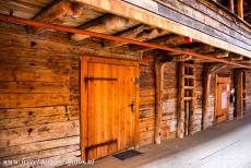 Bryggen - A view down one of the the narrow alleys of Bryggen, the houses were combined living quarters and warehouses. The gable porch provided shelter...