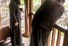 Monasteries of Meteora - Meteora: Two Greek Orthodox monks are busy with hoisting work in the tower of the Varlaam Monastery. The tower of the monastery contains a...
