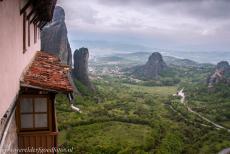 Monasteries of Meteora - Meteora viewed from the Holy Monastery of Roussanou. The monastery is towering high above the small Greek towns of Kalambaka and...