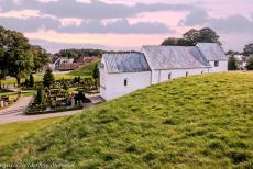 Jelling Mounds, Runic Stones and Church - Jelling Mounds, Runic Stones and Church: The Jelling Church seen from the south burial mound. The Kongernes Jelling Museum is situated opposite...
