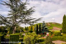 Jelling Mounds, Runic Stones and Church - Jelling Mounds, Runic Stones and Church: The north burial mound viewed from the Jelling Churchyard. When the remains of King Gorm...