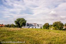 Jelling Mounds, Runic Stones and Church - Jelling Mounds, Runic Stones and Church: The Jelling Church seen from the south burial mound. The Kongernes Jelling Museum is situated opposite...