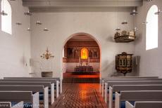 Jelling Mounds, Runic Stones and Church - Jelling Mounds, Runic Stones and Church: The simply furnished interior of the Jelling Church, the frescoes are situated behind the altar in the...