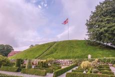Jelling Mounds, Runic Stones and Church - Jelling Mounds, Runic Stones and Church: The south mound. The Royal Standard of Denmark is raised on the Jelling Mounds every summer Sunday....