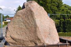 Jelling Mounds, Runic Stones and Church - Jelling Mounds, Runic Stones and Church: The larger of the two runestones at Jelling before it was placed in its protective glass casing. Around... Jelling Mounds, Runic Stones and Church - Jelling Mounds, Runic Stones and Church: The larger of the two runestones at Jelling before it was placed in its protective glass casing. Around...