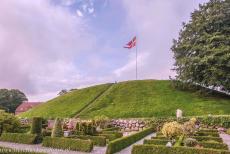 Jelling Mounds, Runic Stones and Church - Jelling Mounds, Runic Stones and Church: The Royal Standard of Denmark is raised on the Jelling Mounds every summer Sunday. The 10-metre-high... Jelling Mounds, Runic Stones and Church - Jelling Mounds, Runic Stones and Church: The Royal Standard of Denmark is raised on the Jelling Mounds every summer Sunday. The 10-metre-high...