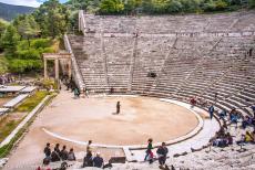 Sanctuary of Asklepios at Epidaurus - The circular stage of the Sanctuary of Asklepios at Epidaurus and the marble entrance gate on the western side of the theatre, as seen...