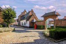 Flemish Béguinage in Diest - A cobbled street with a typical garden gate in the Flemish Béguinage of Diest. Béguines lived in a béguinage (Dutch:... Flemish Béguinage in Diest - A cobbled street with a typical garden gate in the Flemish Béguinage of Diest. Béguines lived in a béguinage (Dutch:...