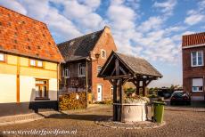 Flemish Béguinage Sint Truiden - Flemish Béguinages: The former water well in the Flemish Béguinage of Sint Truiden, the water well is now used as a flower...