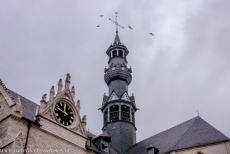 Belfries of Belgium and France - Belfries of Belgium and France: Several crows flying around the slender central tower of the St. Leonard's Church in Zoutleeuw....