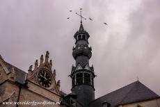 Belfries of Belgium and France - Belfries of Belgium and France: Several crows flying around the slender central tower of the St. Leonard's Church in Zoutleeuw....